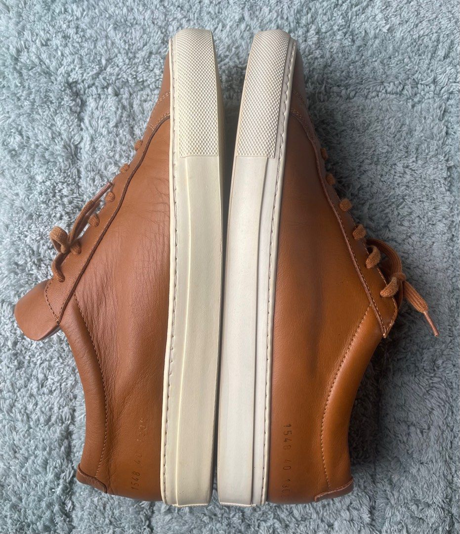 Common Projects Soft Leather Sneaker (Category: Sneakers) located in Iloilo. Submitted by darvoza (Listing ID 1355105026, Image 3). Description: Common Projects Sneaker in soft leather construction in brown color Size 40 on label but fits on Size 41 This great item is slightly used and portrays durability and elegance Comes with no inclusion Slightly negotiable .