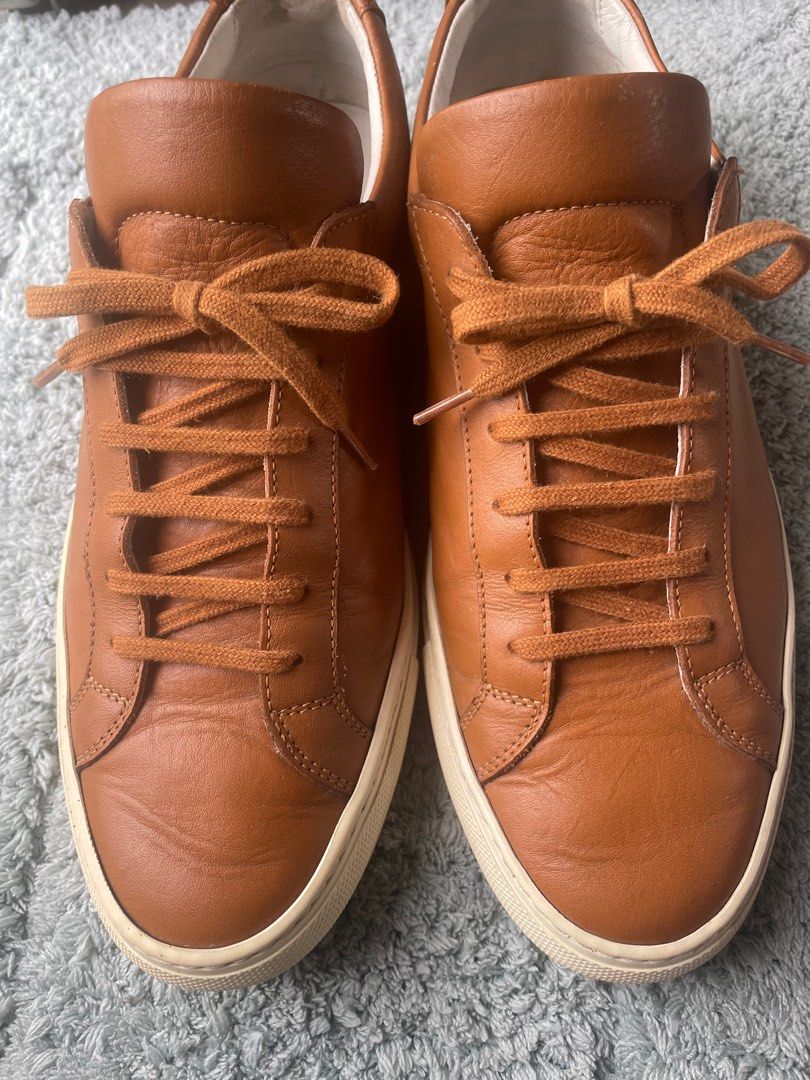 Common Projects Soft Leather Sneaker (Category: Sneakers) located in Iloilo. Submitted by darvoza (Listing ID 1355105026, Image 2). Description: Common Projects Sneaker in soft leather construction in brown color Size 40 on label but fits on Size 41 This great item is slightly used and portrays durability and elegance Comes with no inclusion Slightly negotiable .