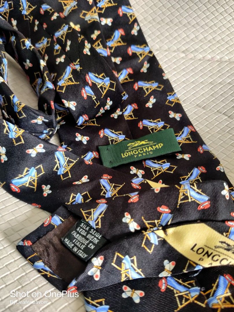 Longchamp Paris ties/neckties (Category: Luxury Accessories) located in Baguio. Submitted by ferns_garage.0924 (Listing ID 1355151055, Image 3). Description: Longchamp Paris ties/neckties made in Italy in very good condition scan pics for reference and other details. wysiwyg, as it is. Red longchamp SOLD 🫡 Black available MOP GCASH The seller is not liable for any damages or loss of items due to mishandling of couriers..