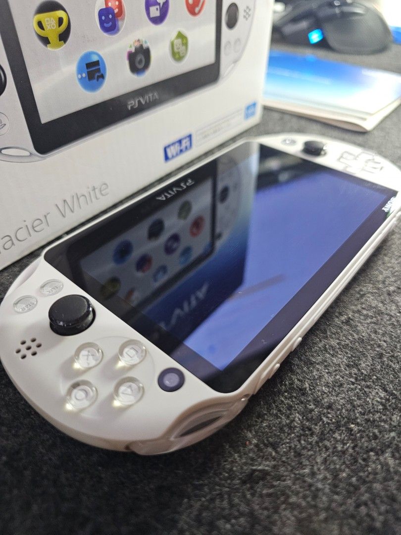 PS Vita Slim Glacier White (Category: PlayStation) located in Paranaque City. Submitted by john020497 (Listing ID 1355278433, Image 3). Description: - Good as new. With very minimal hairline scratches. - Complete with box, manuals, official sony memory card and charger. - Can be modded upom request. Bacoor, Cavite. Delivery via Lalamove/Grab/LBC..