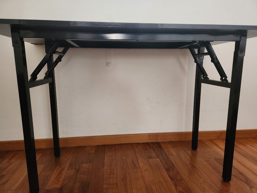 Foldable Table (Category: Tables & Sets) located in Singapore. Submitted by 24601 (Listing ID 1355259126, Image 3). Description: Lightly used foldable black table that can be used for multiple purposes. Size: 120 cm x 60 cm..
