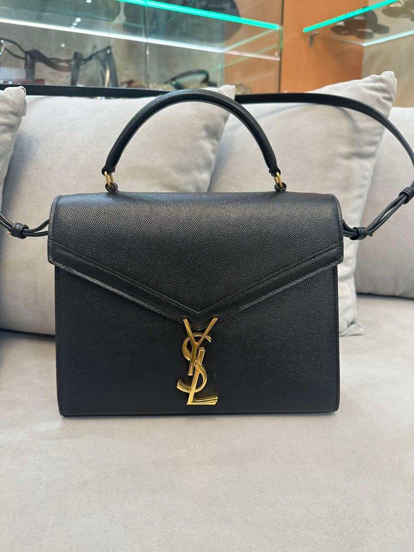 YSL Cassandra Medium Top Handle Bag (Category: Luxury Bags & Wallets) located in Angeles City. Submitted by making__space (Listing ID 1355135055, Image 1). Description: - Cassandra medium top handle bag in grain de poudre embossed leather - Good as new - Bought at the Solaire YSL store - Comes with box, dust bag, and receipt - Open for viewing upon request.