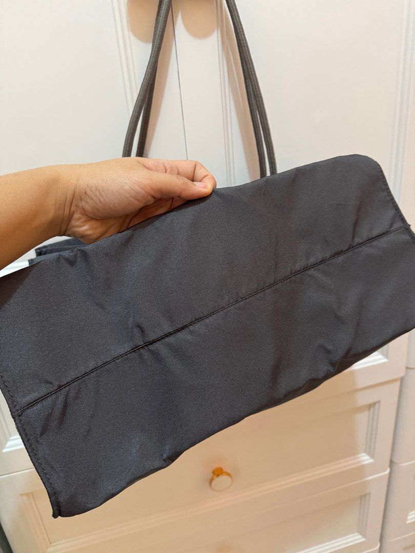 Ferragamo Nylon Tote Limited Edition (Authentic) (Category: Luxury Bags & Wallets) located in Cavite. Submitted by leylamm (Listing ID 1355340132, Image 3). Description: Authentic. 12H,15L. Gray. With minor flaw on last photo (the flaw was from outside only, not butas). Please check first before sending an offer. Nylon material, light and spacious. Used twice only. This is a lovely bag, I just can’t use it because I’m now working from home..