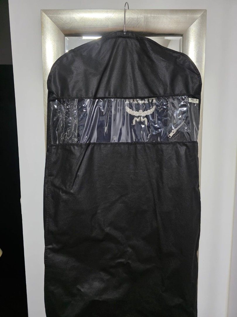 Jacket (Category: Coats, Jackets and Outerwear) located in Singapore. Submitted by mak6666 (Listing ID 1355349784, Image 3). Description: Authentic MCM jacket with detachable leather sleeves, item unworn, condition excellent. Retail price approximately close to $2000 SGD. Purchased from Hong Kong MCM boutique. Comes with Mcm original dust bag. Comes with original tag card with matching number to the dust bag. Shoulder measurement 47 cm, 18.5 inch