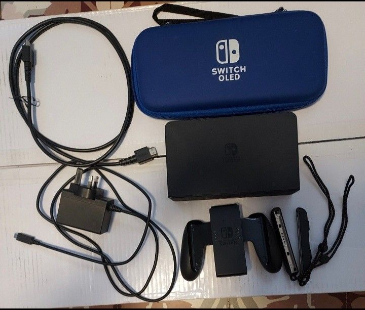 Nintendo Switch Oled (Category: Nintendo) located in Del Monte. Submitted by patricktelescope (Listing ID 1355330218, Image 1). Description: Everything works. Comes with carrying case and rear protective cover, and 15 free online games. More pictures upon request..