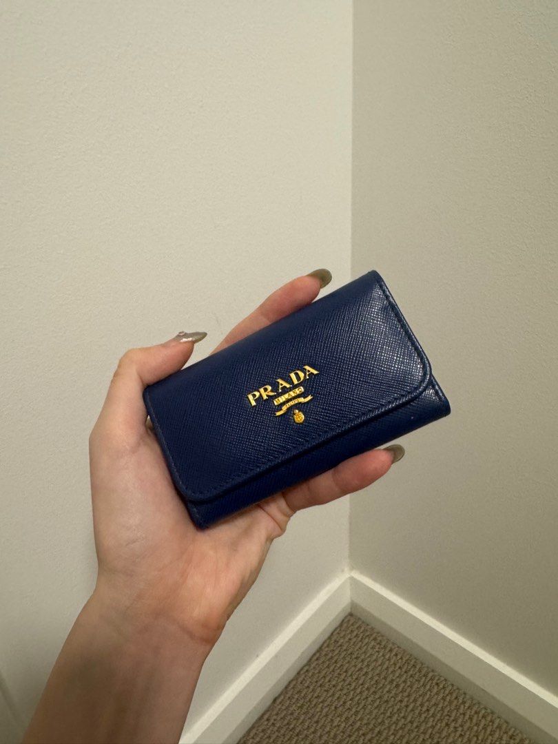 PRADA BLUE SAFFIANO KEY HOLDER - NEW (Category: Bags & Wallets) located in Concord. Submitted by randomassortments (Listing ID 1355401497, Image 2). Description: Never before used, in mint condition. This key holder is now discontinued, very convenient holds 6 keys and can also double up as card holder!.