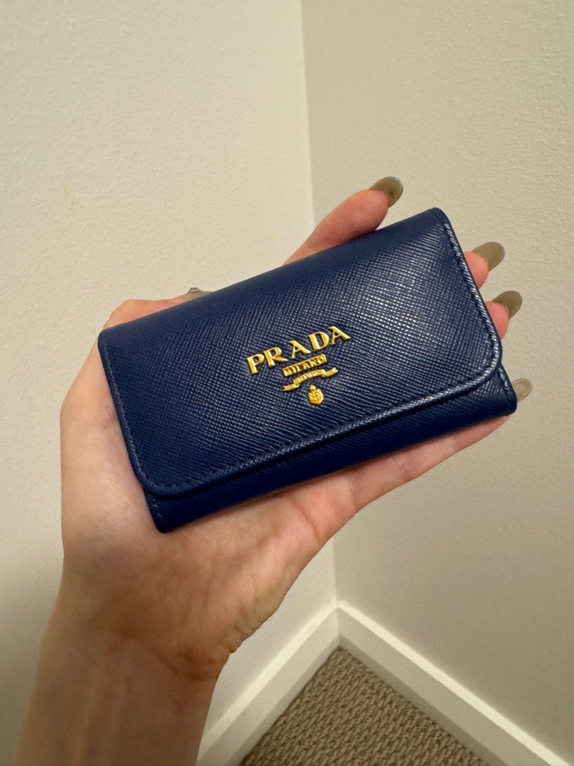 PRADA BLUE SAFFIANO KEY HOLDER - NEW (Category: Bags & Wallets) located in Concord. Submitted by randomassortments (Listing ID 1355401497, Image 1). Description: Never before used, in mint condition. This key holder is now discontinued, very convenient holds 6 keys and can also double up as card holder!.