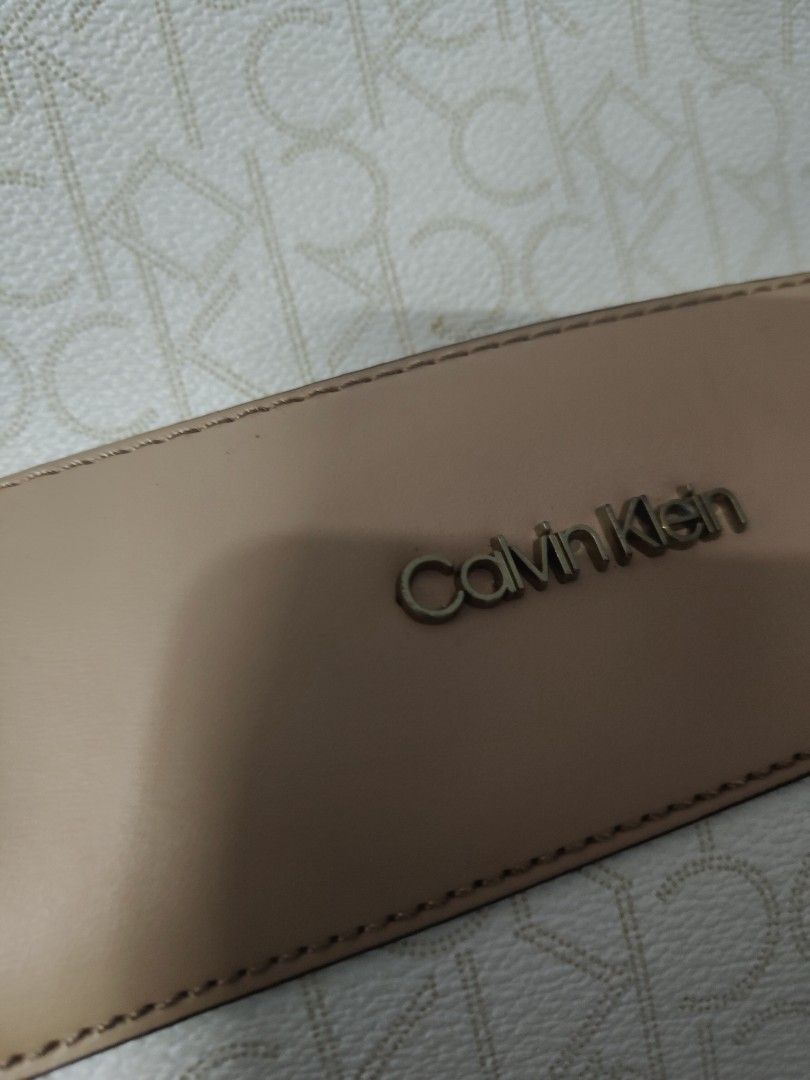 Authentic monogram Calvin Klein CK backpack (Category: Luxury Bags & Wallets) located in Manila. Submitted by anyushka (Listing ID 1355548690, Image 3). Description: Authentic CK backpack. used 3 times. nastock lng sa cabinet. issue ung sa top handle chip due to storage. can be covered by twilly. see picture for reference.