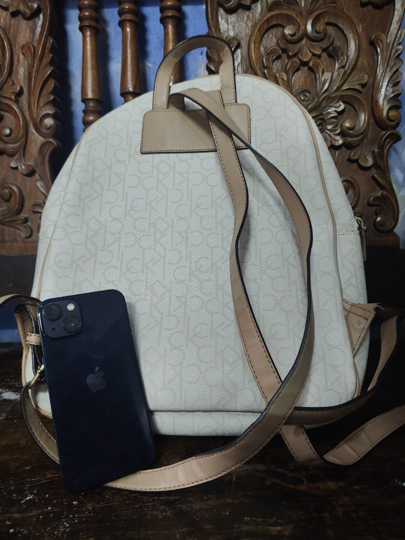 Authentic monogram Calvin Klein CK backpack (Category: Luxury Bags & Wallets) located in Manila. Submitted by anyushka (Listing ID 1355548690, Image 2). Description: Authentic CK backpack. used 3 times. nastock lng sa cabinet. issue ung sa top handle chip due to storage. can be covered by twilly. see picture for reference.