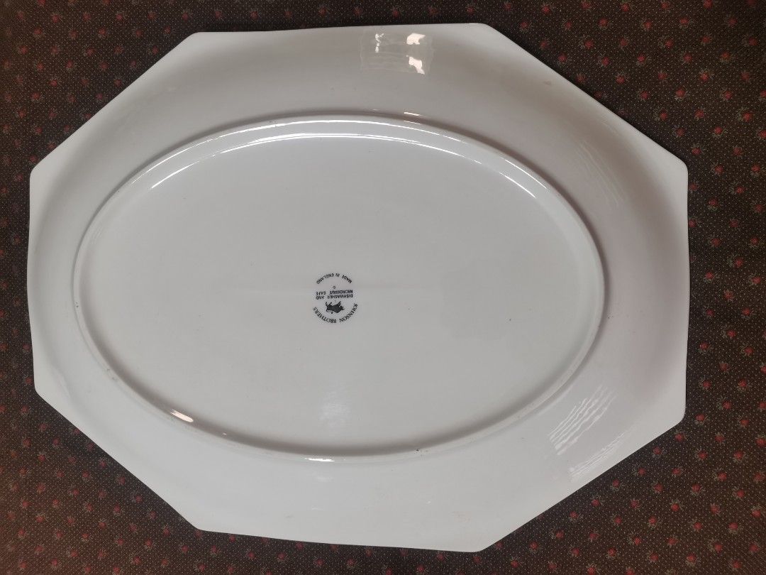 Eternal Beau Serving Platter (Category: Dinnerware & Cutlery) located in Pasig City. Submitted by singledadreseller (Listing ID 1355553472, Image 2). Description: The item is a Johnson Brothers Eternal Beau serving platter, likely dating back to its introduction in 1981. Additional information: Design: Features a distinctive ribbon and bow motif with delicate floral accents on a cream-colored background. Material: Made of porcelain. Shape: Octago