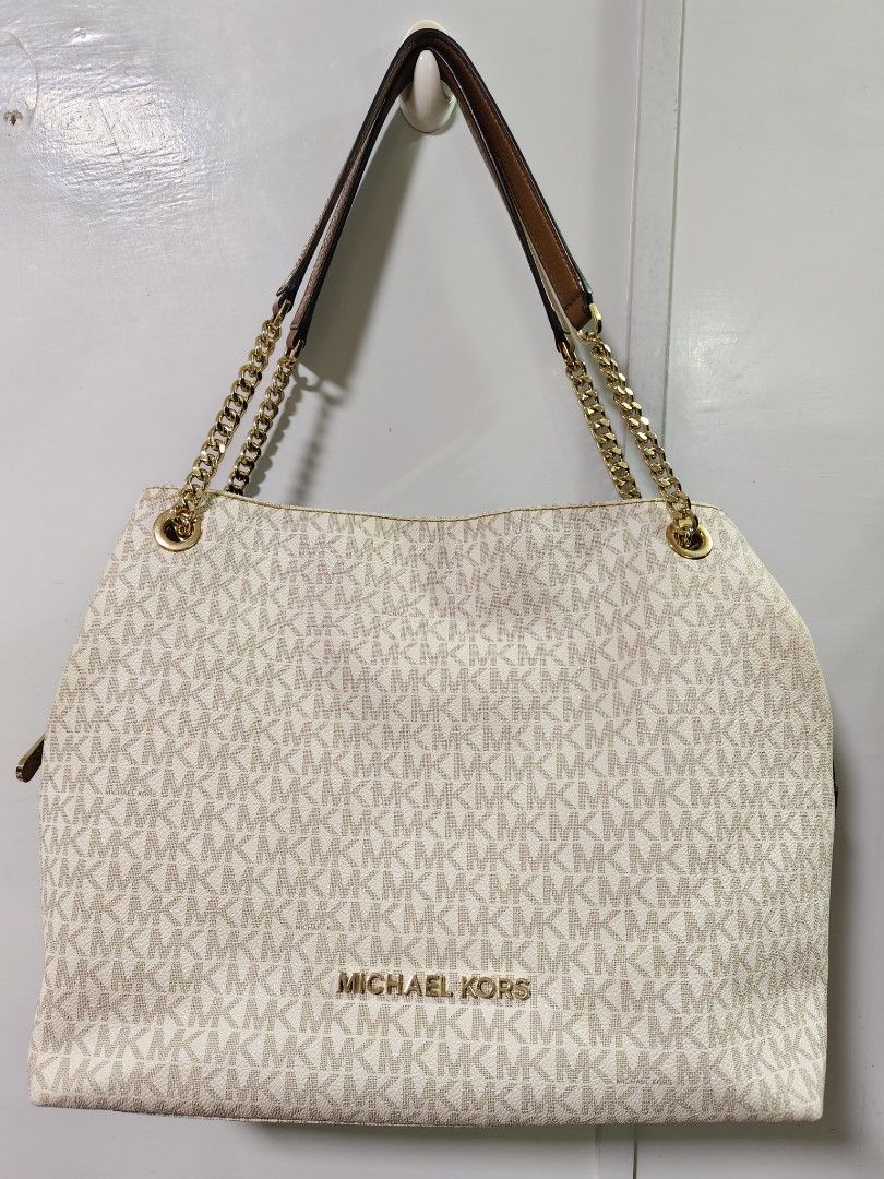 Original Michael Kors Jet Set Chain Shoulder Bag (Category: Luxury Bags & Wallets) located in Bulacan. Submitted by brandnewprelovedstuffatbp. (Listing ID 1355614447, Image 1). Description: MICHAEL KORS JET SET 35F8GTTE3B CHAIN SHOULDER TOTE DESCRIPTION: Gold tone hardware Double straps with leather/ chain link (10.5" Drop) Magnetic snap closure Interior: large center zip compartment with 2 side comparments 1 zipper pocket and 4 slip pockets 13" 