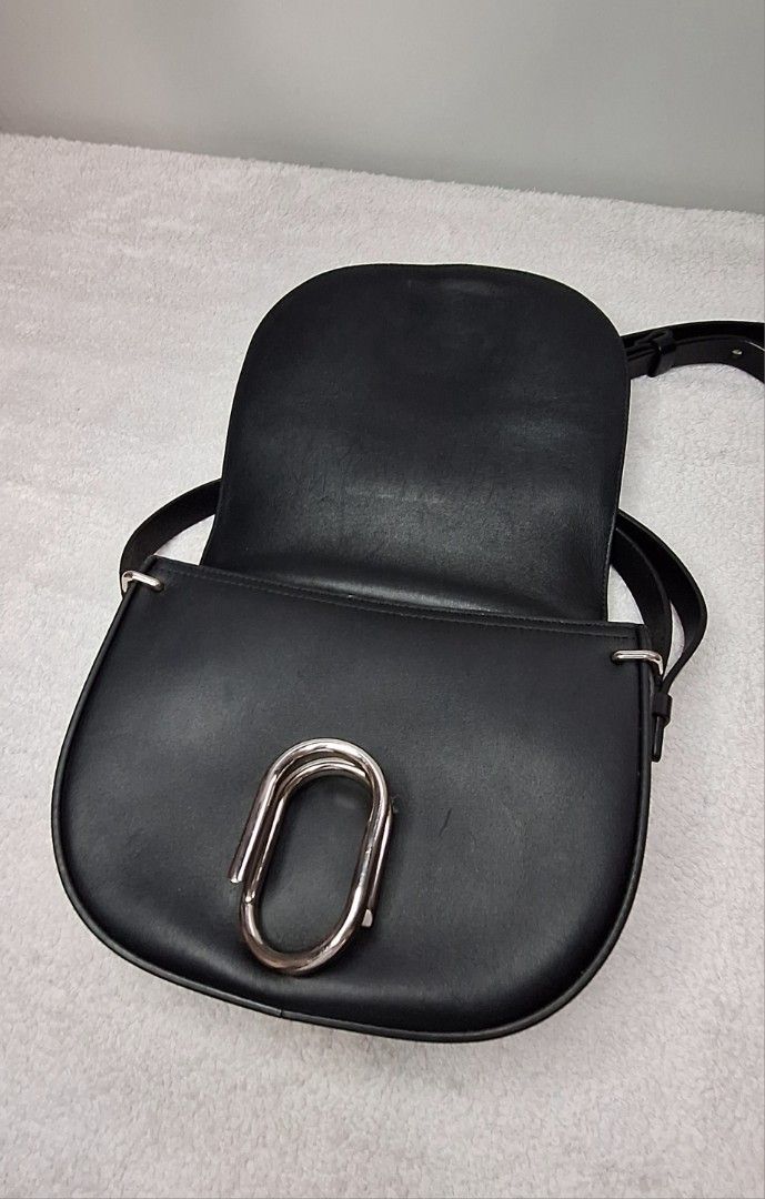 Philip Lim Alix (Category: Luxury Bags & Wallets) located in Pasig City. Submitted by fjrd_relovedluxury28 (Listing ID 1355487691, Image 3). Description: ✅️💯 Authentic ✅️ Quiet Luxury ✅️ Supple Black Calf skin leather ✅️ Silver Hardware ✅️ 17x23x7.5cm *** Hairline scratches due to normal signs of use. Some small cracks on gum liner but not on leather straps itself. The bags leather quality/condition is really good in person. No damges to declare