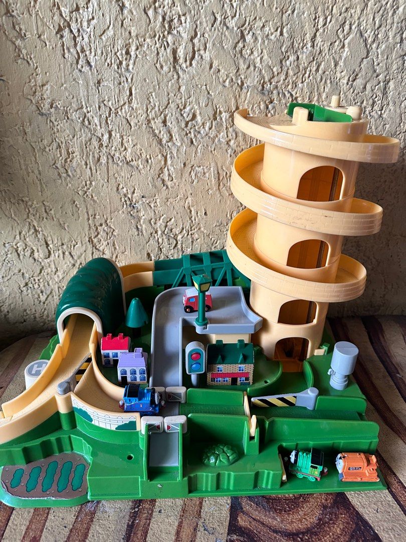 Thomas the train parking playset (Category: Kids Toys) located in Valenzuela. Submitted by kaelstoypalace (Listing ID 1355517843, Image 2). Description: Preloved by my son. Comes with 4 mini trains. AS IS CONDITION .