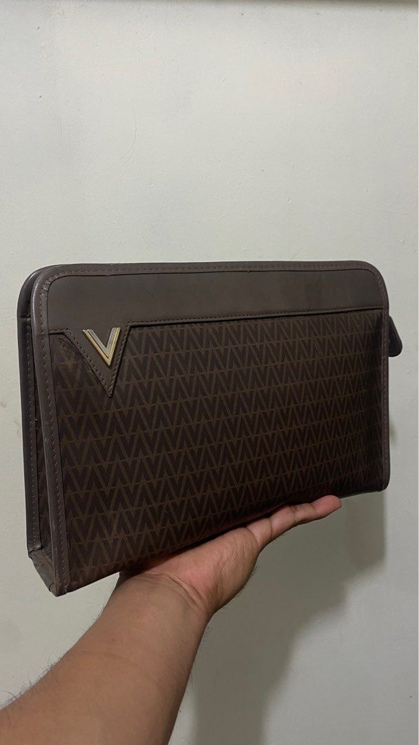 Valentino Clutch Bag (Category: Belt bags, Clutches and Pouches) located in Manila. Submitted by soall (Listing ID 1355621476, Image 1). Description: Mario Valentino Clutch Bag 100% Authentic bought in Japan Leather For men (Unisex also) Condition: 8.5/10 (Faded on some bottom part, overall great condition, kindly see actual photos) Good for formal attire or everyday use. Very presentable.