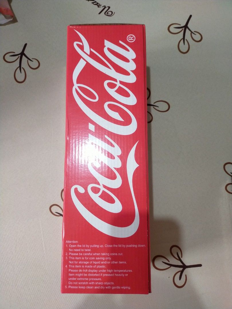 Coca-Cola coin bank with Tag (Category: Vintage Collectibles) located in Quezon City. Submitted by randomthings26 (Listing ID 1350950839, Image 2). Description: Original Coca-Cola coin bank with Tag.