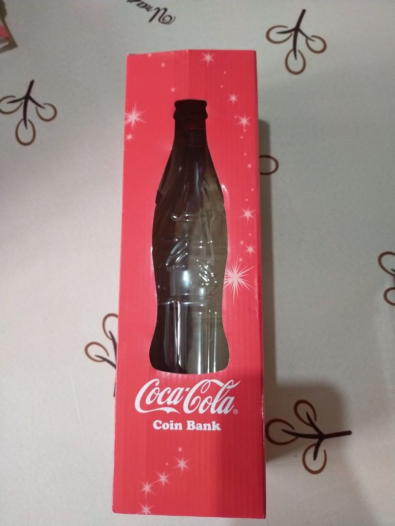 Coca-Cola coin bank with Tag (Category: Vintage Collectibles) located in Quezon City. Submitted by randomthings26 (Listing ID 1350950839, Image 1). Description: Original Coca-Cola coin bank with Tag.