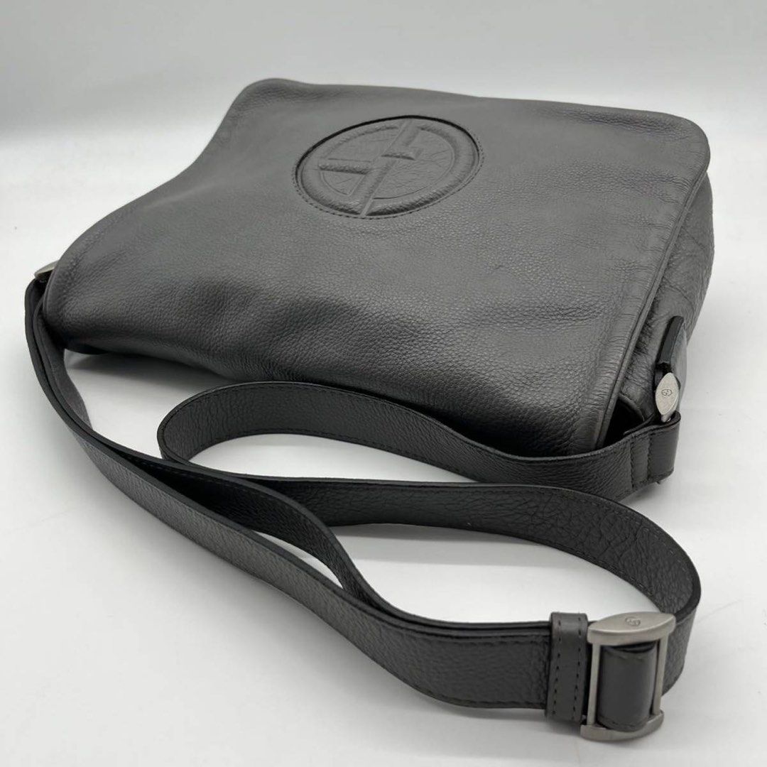 Giorgio Armani Messenger Bag (Category: Luxury Bags & Wallets) located in Baguio. Submitted by thrift_saver07 (Listing ID 1350949926, Image 2). Description: Dark Grey Magnetic Flap Main Conpartment Inner Zip Pocket Zipper 2 compartment Magnetic back compartment Signs of usage Authentic 100% Selling low Giorgio Armani navy calf leather It's a body bag The GA logo is embossed on the leather of the front cover as an accent. This bag is made of soft 