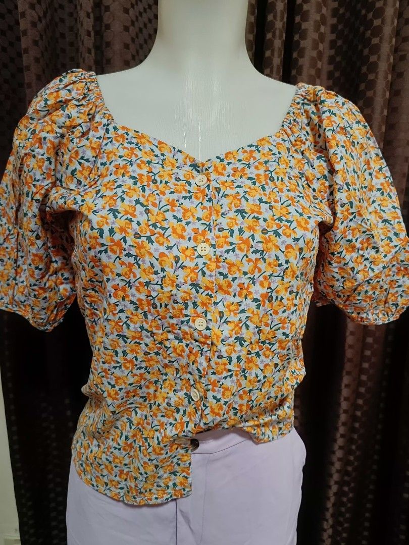 Orange floral puff sleeves (Category: Blouses) located in Quezon City. Submitted by faramiza (Listing ID 1350912226, Image 1). Description: best fit to medium to semi large.