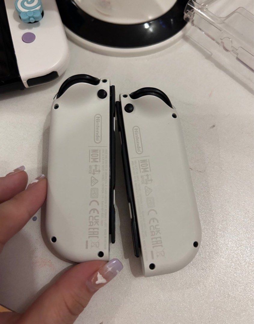 Original OLED joycons (Category: Controllers) located in Binan City. Submitted by abiancake (Listing ID 1350908740, Image 2). Description: Oled joycons Pwede sa maselan no issues no drifting w strap Rfs: extra .
