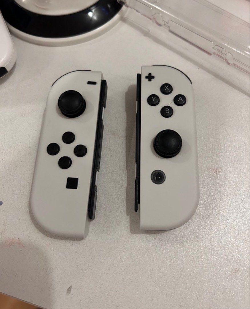 Original OLED joycons (Category: Controllers) located in Binan City. Submitted by abiancake (Listing ID 1350908740, Image 1). Description: Oled joycons Pwede sa maselan no issues no drifting w strap Rfs: extra .