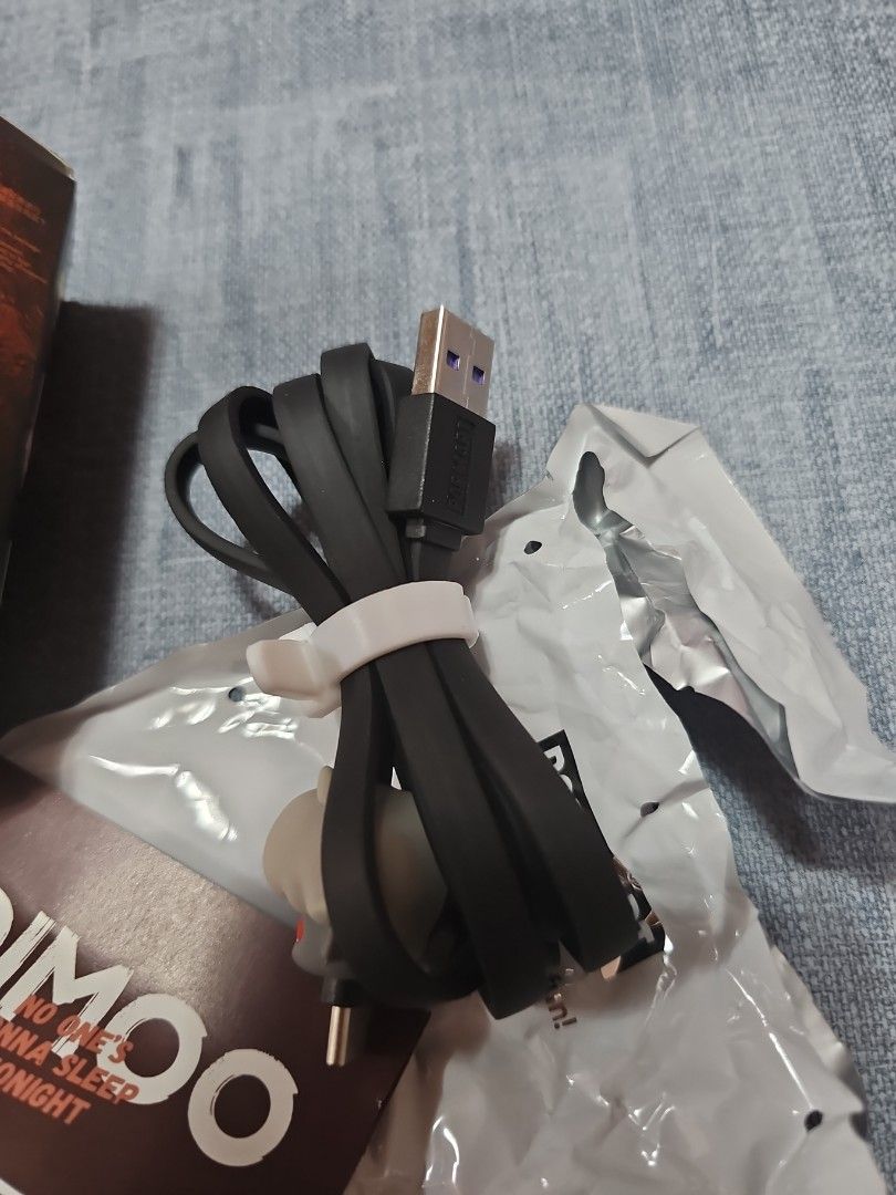 Pop Mart [black] Dimoo Type C cable (Category: Chargers & Cables) located in Las Pinas. Submitted by gl3nndita (Listing ID 1350942104, Image 2). Description: Pop Mart Original USB to Type C cable Dimoo No One's Gonna Sleep Tonight series Little Dvl Colorway: black cord, dark purple and gray face character Complete: box opened from bottom, product leaflet, open / unsealed foil.
