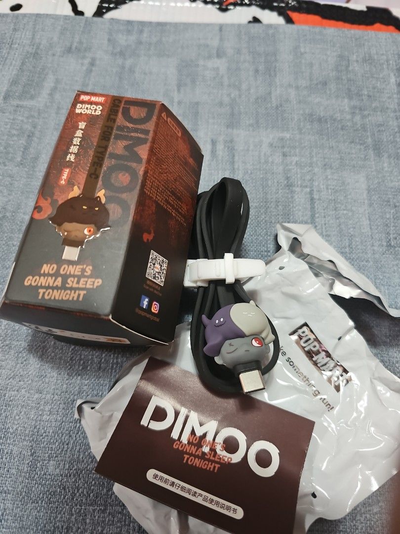 Pop Mart [black] Dimoo Type C cable (Category: Chargers & Cables) located in Las Pinas. Submitted by gl3nndita (Listing ID 1350942104, Image 1). Description: Pop Mart Original USB to Type C cable Dimoo No One's Gonna Sleep Tonight series Little Dvl Colorway: black cord, dark purple and gray face character Complete: box opened from bottom, product leaflet, open / unsealed foil.