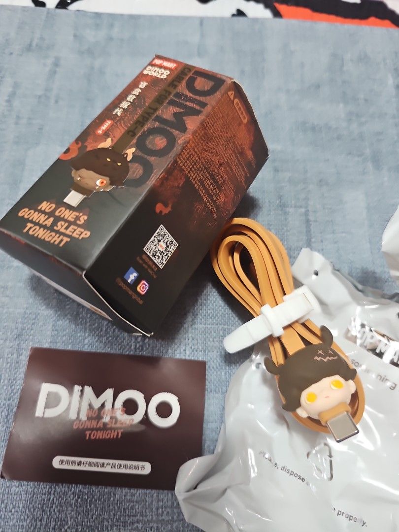 Pop Mart [tan/brown] Dimoo USB to Type C cable (Category: Chargers & Cables) located in Las Pinas. Submitted by gl3nndita (Listing ID 1350943177, Image 1). Description: Pop Mart Original USB to Type C cable Dimoo No One's Gonna Sleep Tonight series Character: Deer Colorway: tan cord, brown face character Complete: box opened from top, product leaflet, open / unsealed foil.