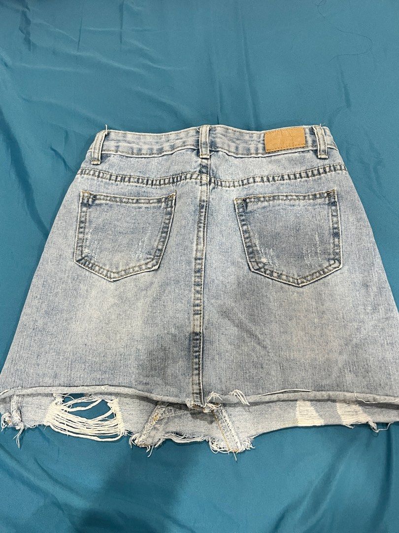 Tattered Denim Skirt (Category: Skirts) located in Manila. Submitted by declutterwithnicole (Listing ID 1351069376, Image 2). Description: fits 27-28 waistline.