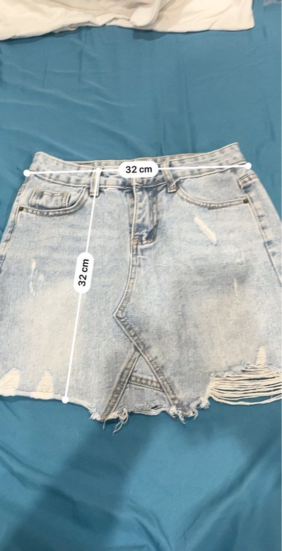 Tattered Denim Skirt (Category: Skirts) located in Manila. Submitted by declutterwithnicole (Listing ID 1351069376, Image 3). Description: fits 27-28 waistline.