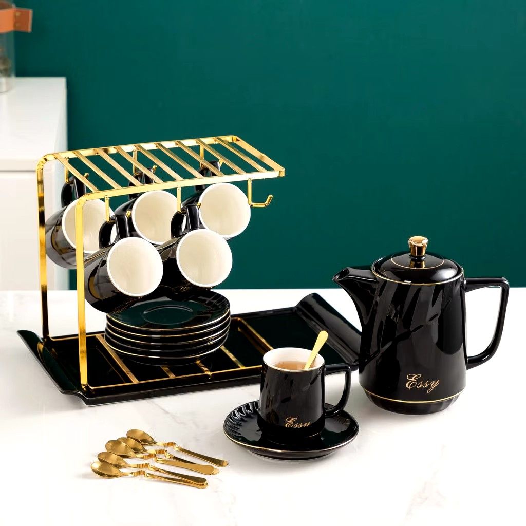 14 pcs Luxury Elegant Tea pot and Tea cups Set (Category: Coffee & Tea Tableware) located in Manila. Submitted by cristytah (Listing ID 1351125720, Image 3). Description: Set includes: 6 cups, 6 plate, 1 Gold rack, 1 pot and 6 free spoon Measurements: ● Teacup-220mL 6.2x8.5cm ● Teapot-1150mL 9.6x19cm Dish-14x1.8cm ● Rack-24x15.2x22.5cm Perfect as a gift or to use at home! Quality+Aesthetics Gift Box.