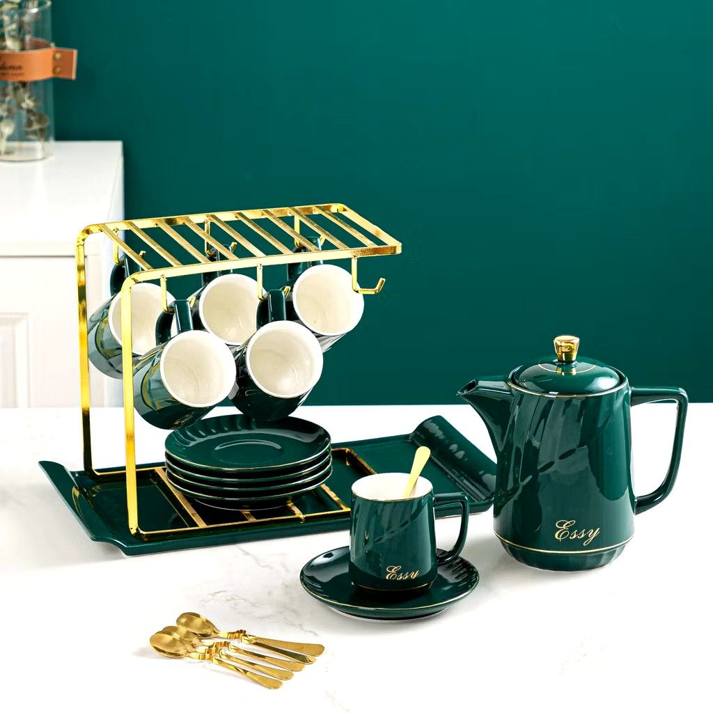 14 pcs Luxury Elegant Tea pot and Tea cups Set (Category: Coffee & Tea Tableware) located in Manila. Submitted by cristytah (Listing ID 1351125720, Image 2). Description: Set includes: 6 cups, 6 plate, 1 Gold rack, 1 pot and 6 free spoon Measurements: ● Teacup-220mL 6.2x8.5cm ● Teapot-1150mL 9.6x19cm Dish-14x1.8cm ● Rack-24x15.2x22.5cm Perfect as a gift or to use at home! Quality+Aesthetics Gift Box.