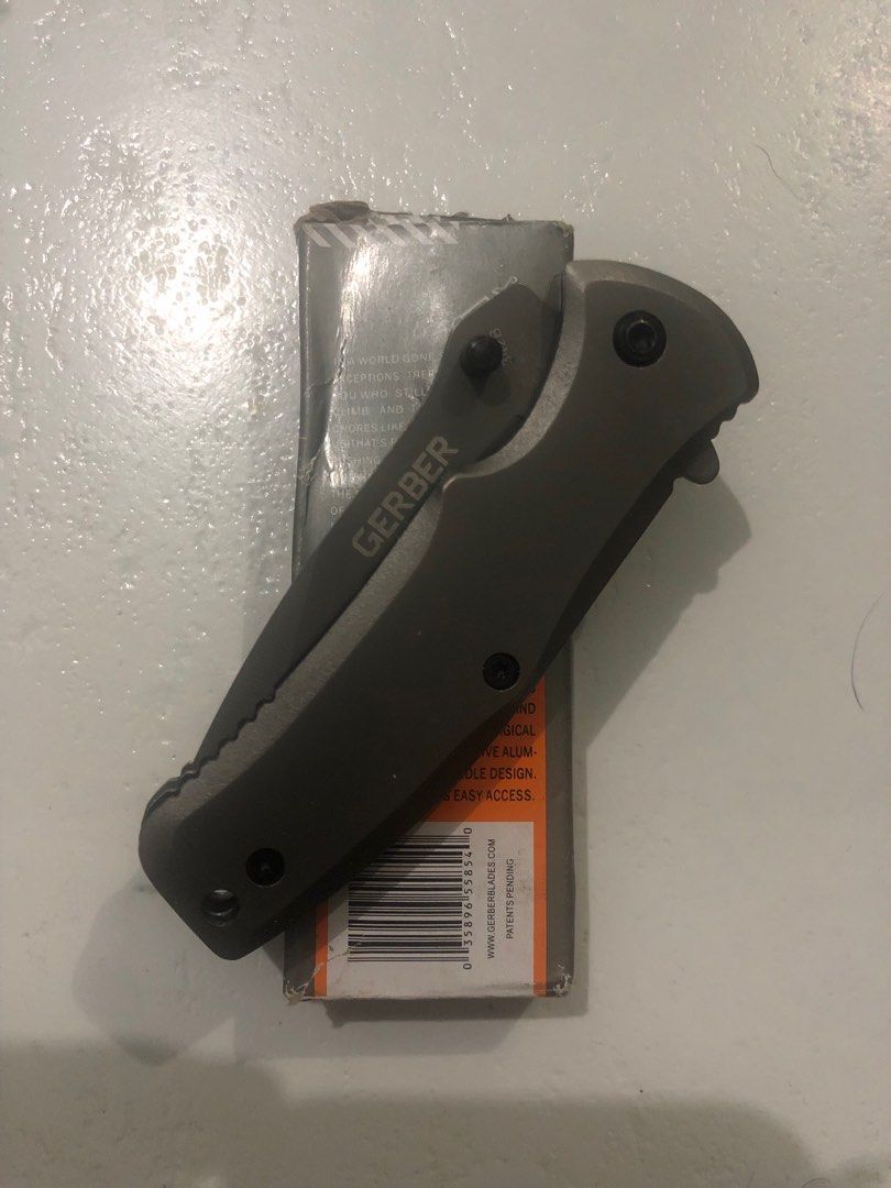 Gerber Utility Knife (Category: Hiking & Camping) located in Pasig City. Submitted by wild_rex_blaza (Listing ID 1351222035, Image 2). Description: Gerber Utility Knife Branded preloved item Gray Alloy 2.0 inches Location: westbank road, Cainta ( pasig border) Pin: Bluestar Lying in clinic Reason for selling: decluttering knife collection. Never nagamit.