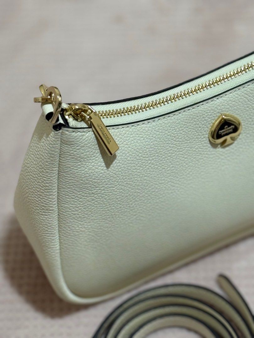 Kate Spade Kayla Shoulder Bag, Meringue (Category: Luxury Bags & Wallets) located in Muntinlupa City. Submitted by preloved_bymissm (Listing ID 1351192021, Image 3). Description: - Comes with 2 straps (short and long adjustable) - Can be used as shoulder bag and crossbody bag.