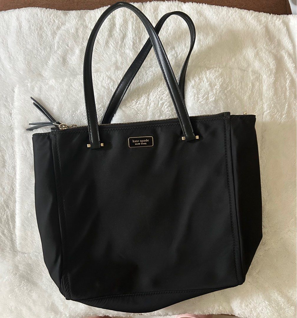 KS Black Nylon bag (Category: Luxury Bags & Wallets) located in Pateros City. Submitted by Nanet39 (Listing ID 1351159797, Image 1). Description: This KS Nylon medium sized black bag with sling is still in pristine condition. Overall the bag can still be used with only a few fades on the hardwares especially on the zipper pulleys. Minimal flaw is the tiny rubber lining on the handle. See last picture for your reference. Msg me for more details. R