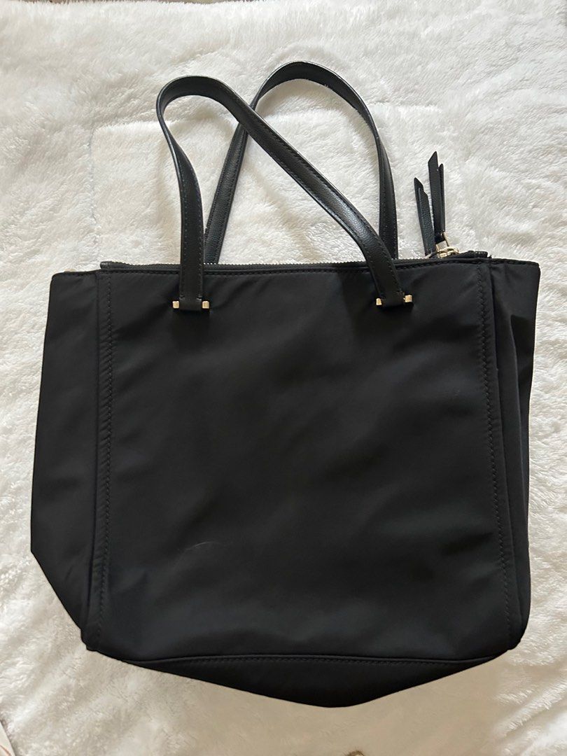 KS Black Nylon bag (Category: Luxury Bags & Wallets) located in Pateros City. Submitted by Nanet39 (Listing ID 1351159797, Image 2). Description: This KS Nylon medium sized black bag with sling is still in pristine condition. Overall the bag can still be used with only a few fades on the hardwares especially on the zipper pulleys. Minimal flaw is the tiny rubber lining on the handle. See last picture for your reference. Msg me for more details. R