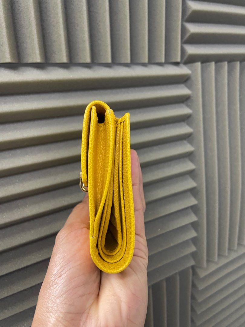 SALVATORRE FERRAGAMO Gancini yellow Compact Wallet (Category: Luxury Bags & Wallets) located in Manila. Submitted by luxemax_09 (Listing ID 1351128057, Image 3). Description: .