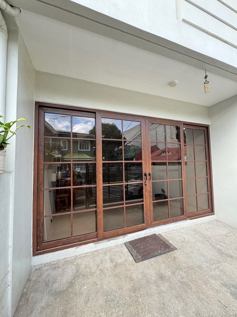 Sliding door (Category: Office Furniture & Fixtures) located in Antipolo. Submitted by rianikasuason (Listing ID 1351112024, Image 2). Description: 7' H x 12'3.5" 4 panel (Fixed-Slide-Slide-Fixed) Door French style Brown uPVc frame 6mm Tempered glass With fibermesh insect screen.