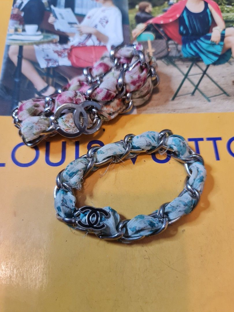 Chanel Multicolor Charm Fabric (Category: Luxury Accessories) located in Angeles City. Submitted by reallygraceful (Listing ID 1351274255, Image 1). Description: Chanel Multicolor Charm Fabric 🩷Good Condition 🩷10 yo Chanel bracelet bought in Hk 🩷walang lock di pasok lang sa hands 🩷naka stock lang di ko na nagamit 🩷walang kalawang 🩷2 pcs na free na yung Isa 🩷minor flaws may excess fabric NO LOW-BALLING ❌️.