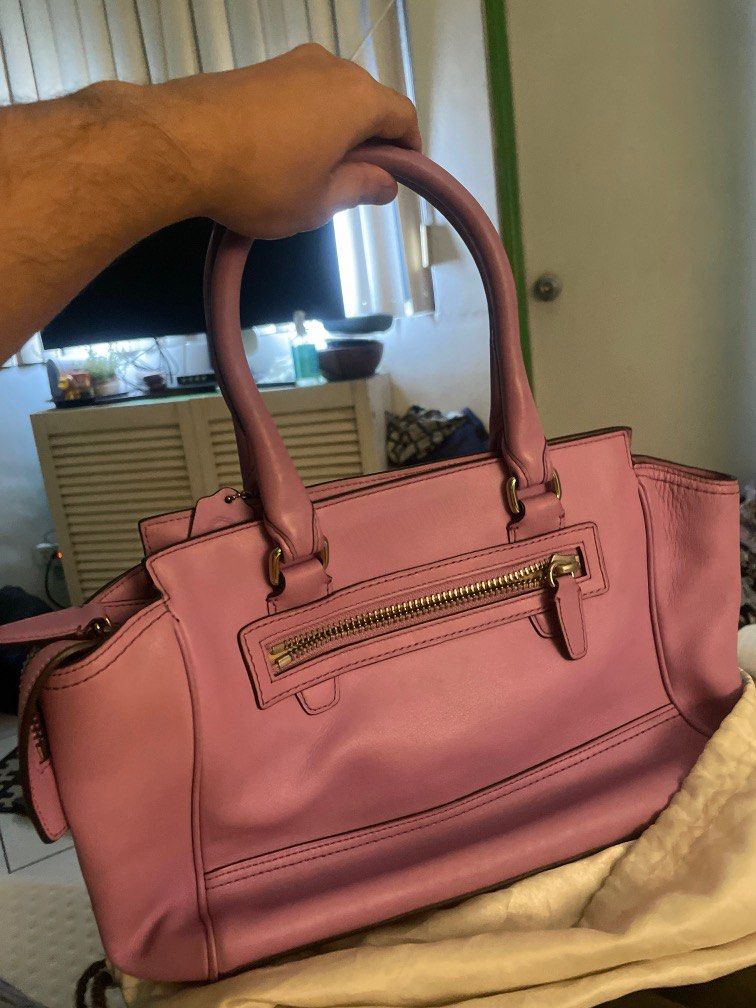 Coach Legacy bag (Category: Purses & Pouches) located in Manila. Submitted by max0693 (Listing ID 1351421801, Image 3). Description: rare color of Light purple coach bag. unused, with dustbag. Guaranteed original. Still negotiable. rfs: decluttering of sister's bag collection. this was unused and kept inside the closet for quite sometime. Signs of ageing... .