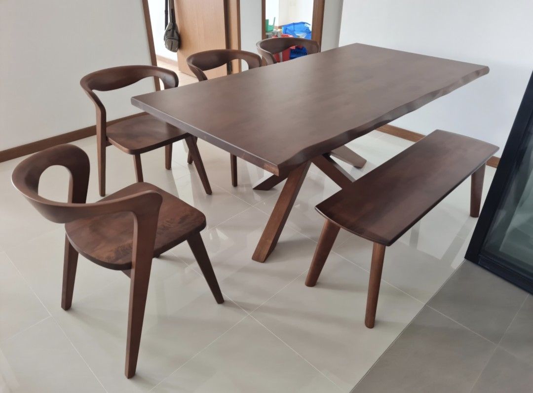 Dining Table Set (Category: Tables & Sets) located in Singapore. Submitted by sy_12345 (Listing ID 1351318872, Image 1). Description: 1.8metres long solid wood dining table set. Gives a matt feeling when touched. Comes with 4 chairs and 1 bench. Used for a year with a few noticeable scratches on one side of the table top. Selling away as it is too huge for my toddler running around the house. Retail price over $3,500. Selling for $1200. Arrange o