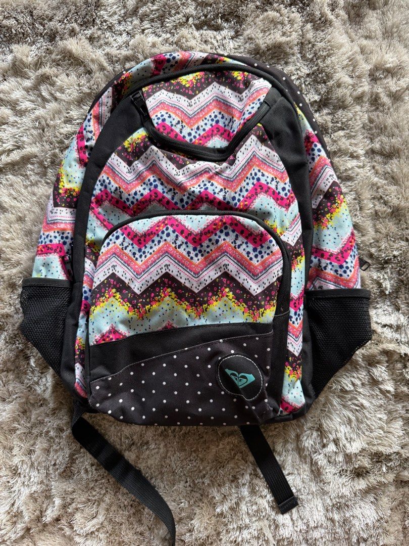 ROXY backpack (Category: Backpacks) located in Marikina City. Submitted by samndbx (Listing ID 1351323059, Image 2). Description: Original Roxy bag Perfect for school or weekend trips or getaways It has 2 pockets in front: Big pocket has small pockets inside for cards, coins, and pens. The smaller pocket (upper part) can hold chargers, airpods, etc. There are 2 big compartments: Middle compartment has 2 cm in depth Main compartment has 13.5cm in 