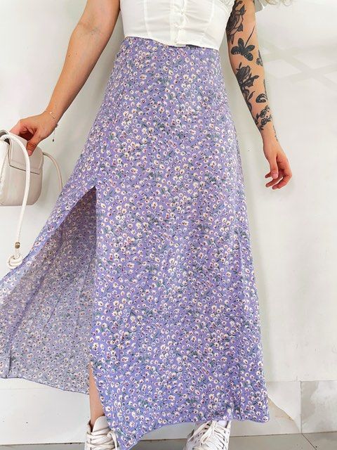 SHEIN Floral Maxi Skirt (Category: Skirts) located in Pagbilao. Submitted by ajmm_29 (Listing ID 1351238282, Image 3). Description: Condition: Like new. Worn once. No flaws. Material: 100% Polyester Length: Midi Fabric: material has no stretch, thin but soft and comfy to wear Features: floral print, high waist, button details, zipper back Color: Lilac purple .