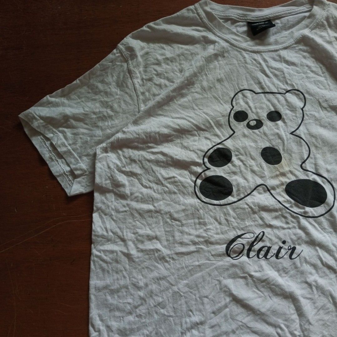 Sinclair Global Anniversary Bear T-shirt (Category: Luxury Apparel) located in Tayabas. Submitted by cat.b0i (Listing ID 1351279131, Image 2). Description: Sinclair Global Anniversary Bear T-shirt Fitting: M- (Semi XL-XL) F - (XL-semi 2XL) length: 29 width: Body: 22 Shoulder: 19.5 arm space: 9.5 sleeve length: 8.5 color: white with black graphic material: 100% cotton issue: washable stains condition: excellent.