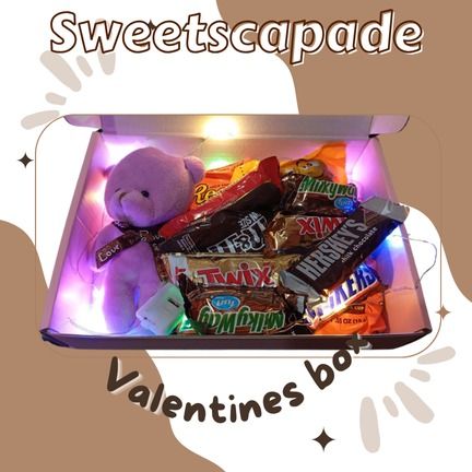 Valentines Gift for your GF or BF (Category: Gift Baskets & Hampers) located in Taguig. Submitted by declutterbydebbie (Listing ID 1351329449, Image 1). Description: 12 pieces chocolates 1 teddy bear with box and card with light.