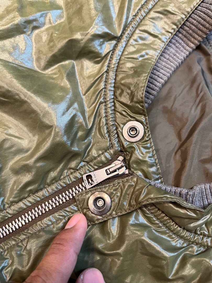 Vintage Gucci Tom Ford Green Polyamide Bomber Jacket (Category: Luxury Apparel) located in Quezon City. Submitted by forgarments (Listing ID 1351401723, Image 3). Description: Vintage Gucci Tom Ford Green Polyamide Bomber Jacket Excellent Condition Size: 48 Shoulder: 19 Inches Chest width: 23 Inches Sleeve: 27 Inches Length: 25 Inches Hem: 18.5 Inches Tom Ford-era Gucci bomber in green polyamide. Features a snap-button flap at the neck, reminisce