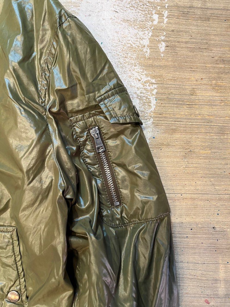 Vintage Gucci Tom Ford Green Polyamide Bomber Jacket (Category: Luxury Apparel) located in Quezon City. Submitted by forgarments (Listing ID 1351401723, Image 2). Description: Vintage Gucci Tom Ford Green Polyamide Bomber Jacket Excellent Condition Size: 48 Shoulder: 19 Inches Chest width: 23 Inches Sleeve: 27 Inches Length: 25 Inches Hem: 18.5 Inches Tom Ford-era Gucci bomber in green polyamide. Features a snap-button flap at the neck, reminisce