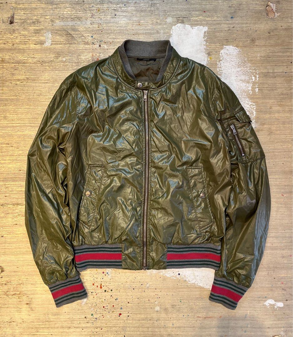 Vintage Gucci Tom Ford Green Polyamide Bomber Jacket (Category: Luxury Apparel) located in Quezon City. Submitted by forgarments (Listing ID 1351401723, Image 1). Description: Vintage Gucci Tom Ford Green Polyamide Bomber Jacket Excellent Condition Size: 48 Shoulder: 19 Inches Chest width: 23 Inches Sleeve: 27 Inches Length: 25 Inches Hem: 18.5 Inches Tom Ford-era Gucci bomber in green polyamide. Features a snap-button flap at the neck, reminisce
