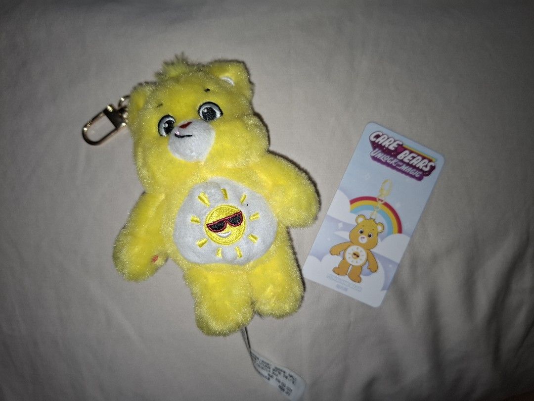 Care Bears Unlock the magic (Funshine Bear) (Category: Designer & Blind Box Toys) located in Manila. Submitted by msmacaroon (Listing ID 1351437373, Image 1). Description: Didnt use, i only hang it w/ my other keychains W/ box & foil Bought at Popmart hongkong selling it for low price MOP: Gcash, BDO MOD: lalamove (payment must be shouldered by the buyer) Loc: Vito cruz taft manila.