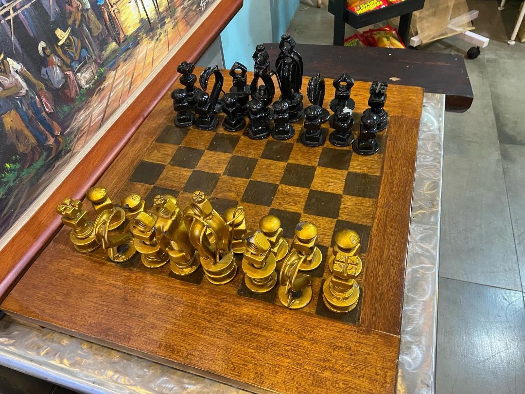 Custom made chess table with recycled bolts and nuts (Category: Other Home Furniture) located in Cavite. Submitted by mycoachvault (Listing ID 1351564436, Image 1). Description: ♟️On hand. Can be shipped asap. ♟️Negotiable. -- ♟️Custom Made Chess table with recycled bolt and nuts as chess pieces. ♟️Table is made of steel, chairs and chessboard are made of wood. ♟️This was made during the pandemic my Meralco employees and it was auctioned for char