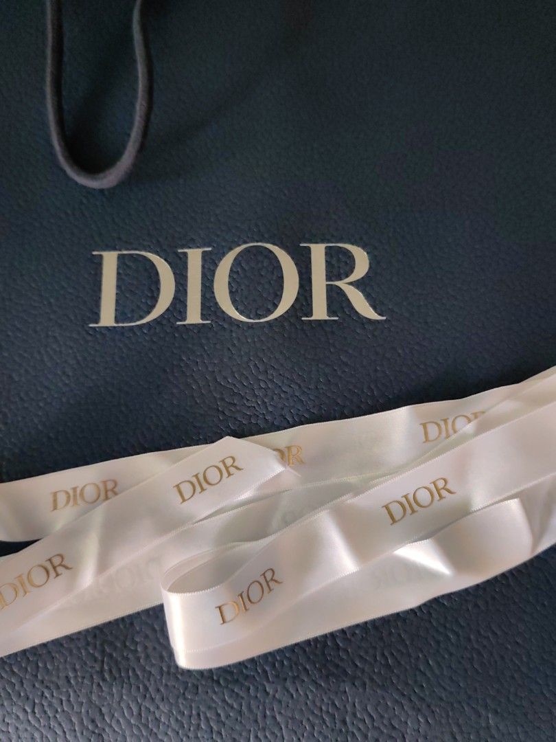 Dior paperbag (Category: Luxury Accessories) located in Makati City. Submitted by kruelscloset (Listing ID 1351435331, Image 2). Description: Original Dior paperbag with satin white ribbon. Size 14 x 17 in.